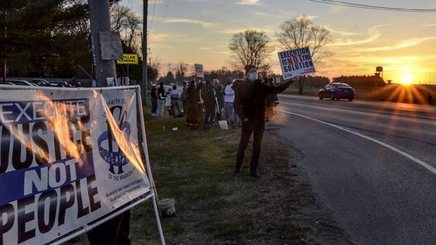 Protesters line Prairieton Road across from the Federal Death Chamber in Terre Haute during a protest against the execution of Brandon Bernard on December 10, 2020. (AP Photo) Protesters line Prairieton Road across from the Federal Death Chamber in Terre Haute during a protest against the execution of Brandon Bernard on December 10, 2020. (AP Photo)