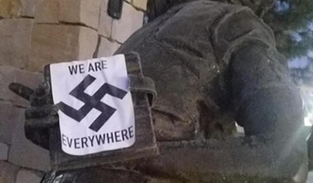 In this photo provided by the Wassmuth Center for Human Rights, a swastika sticker is seen on a sculpture at the Idaho Anne Frank Human Rights Memorial in Boise, Idaho on Tuesday, Dec. 8, 2020. Boise police are investigating after the memorial was defaced by swastika stickers earlier this week. The stickers, which included the words, "we are everywhere" as well as the Nazi insignia, were discovered Tuesday morning by a visitor to the memorial in downtown Boise. (AP)