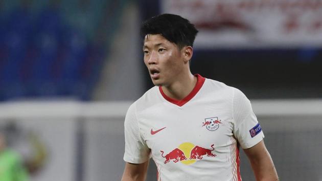 FILE - In this Tuesday, Oct. 20, 2020 file photo, Leipzig's Hwang Hee-chan runs during their Champions League group H soccer match against Basaksehir Istanbul in Leipzig, Germany. Hwang Hee-chan felt “almost dead” for a week when he was infected with the coronavirus, coach Julian Nagelsmann said Friday, Dec. 11. Hwang tested positive last month after returning from the South Korean national team's friendly games in Austria against Mexico and Qatar. (AP Photo/Markus Schreiber, file)(AP)