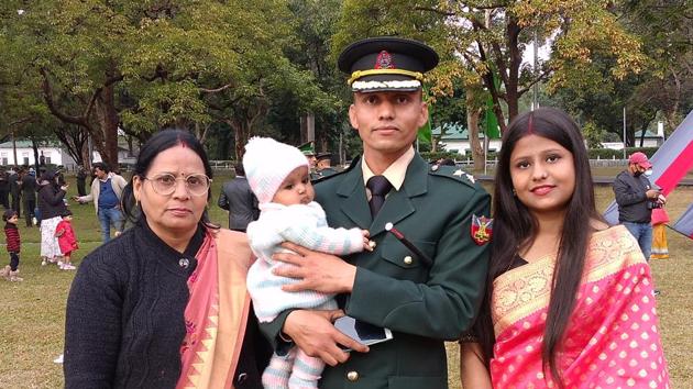 Tiwari met his newly born daughter for the first time after three months at the IMA passing out parade.(HT Photo) Tiwari met his newly born daughter for the first time after three months at the IMA passing out parade.(HT Photo)