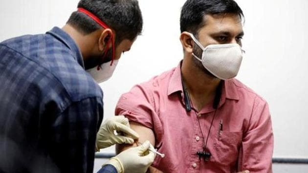 A medic administers COVAXIN, an Indian government-backed experimental Covid-19 vaccine, to a health worker during its trials. (Reuters file photo) A medic administers COVAXIN, an Indian government-backed experimental Covid-19 vaccine, to a health worker during its trials. (Reuters file photo)