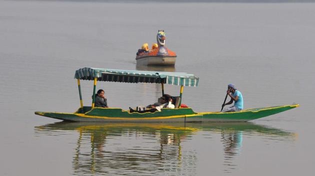 Visitors enjoying sunny weather at Sukhna Lake in Chandigarh on Wednesday. (Keshav Singh/HT) Visitors enjoying sunny weather at Sukhna Lake in Chandigarh on Wednesday. (Keshav Singh/HT)