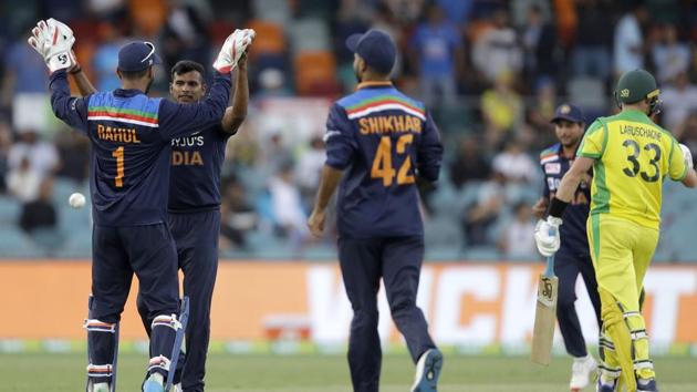 India's Thangarasu Natarajan, second left, is congratulated by teammate India's K.L. Rahul (AP) India's Thangarasu Natarajan, second left, is congratulated by teammate India's K.L. Rahul (AP)