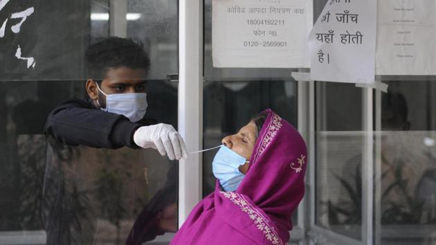 File photo: A health worker collects a swab sample from a woman to test for Covid-19 infection. (Sunil Ghosh / Hindustan Times) File photo: A health worker collects a swab sample from a woman to test for Covid-19 infection. (Sunil Ghosh / Hindustan Times)