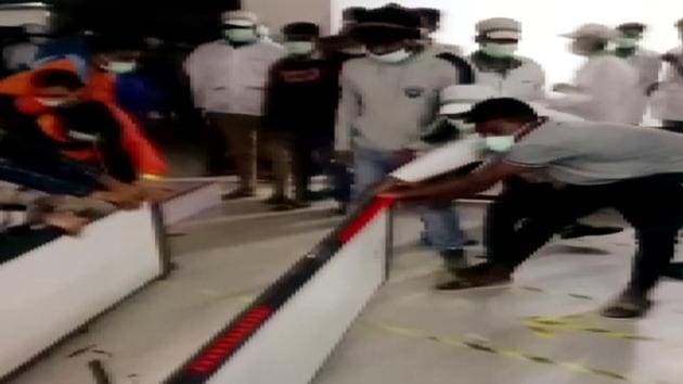 Violence erupts at the Wistron iPhone manufacturing unit over delayed salary payment, in Kolar on Saturday. (ANI Photo) Violence erupts at the Wistron iPhone manufacturing unit over delayed salary payment, in Kolar on Saturday. (ANI Photo)