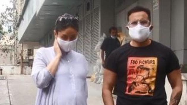 Saif Ali Khan and Kareena Kapoor outside a clinic.