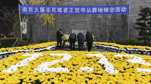 A confident-sounding Communist Party of China spoke of a brighter future as it remembered the victims at a ceremony Sunday on the 83rd anniversary of the Nanjing massacre (AP)