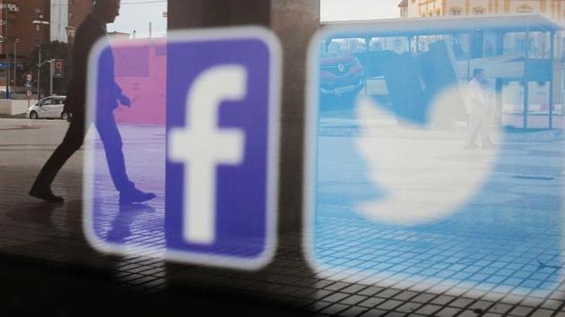 Facebook and Twitter logos are seen on a shop window in Malaga, Spain.(REUTERS) Facebook and Twitter logos are seen on a shop window in Malaga, Spain.(REUTERS)