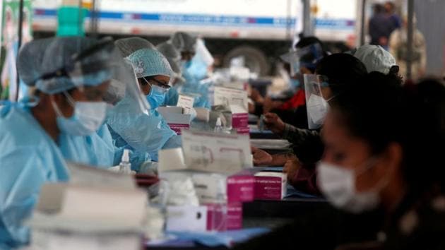 Healthcare workers collect blood samples at a coronavirus disease (COVID-19) testing site in Lima, Peru. (REUTERS) Healthcare workers collect blood samples at a coronavirus disease (COVID-19) testing site in Lima, Peru. (REUTERS)