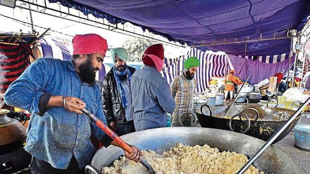 Meals being prepared in a community kitchen at Singhu border. (Raj K Raj/HT PHOTO) Meals being prepared in a community kitchen at Singhu border. (Raj K Raj/HT PHOTO)