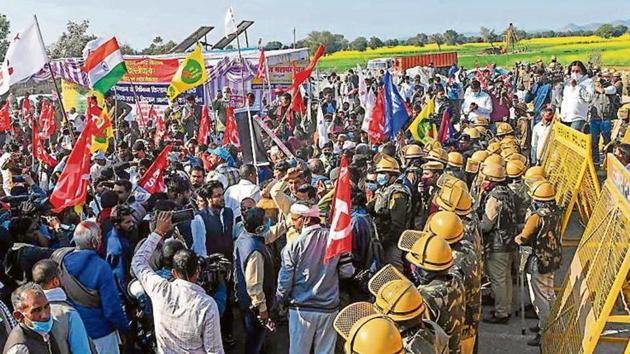 Farmers protest along the Haryana-Rajasthan border. (AFP) Farmers protest along the Haryana-Rajasthan border. (AFP)