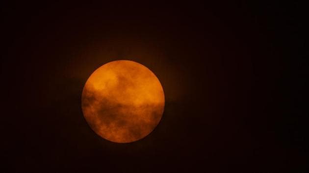 The sun is seen through the clouds on the slopes of Villarrica volcano, in Pucon, Chile on December 13, 2020.(AFP Photo)