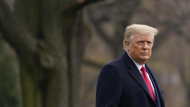 President Donald Trump walks on the South Lawn of the White House in Washington before boarding Marine One.(AP)