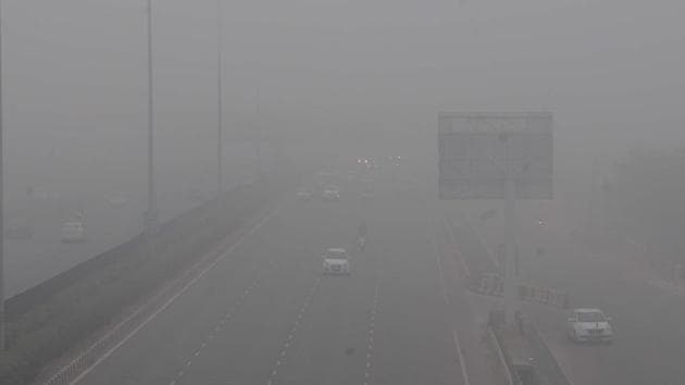 The Delhi-Gurugram expressway shrouded in a thick layer of fog, near IFFCO Chowk, in Gurugram on December 13. Cold weather conditions prevailed in many parts of Haryana on December 14, with Hisar recording a low of 6.2 degrees Celsius,. However, minimum temperatures at Karnal and Ambala hovered slightly above normal limits at 10.8 degrees Celsius and 9.5 degrees Celsius, respectively. (Parveen Kumar / HT Photo) 