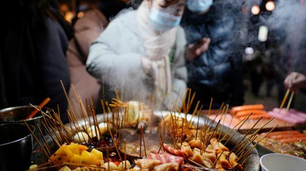 Local snacks are seen at a street market almost a year after the global outbreak of the coronavirus disease in Wuhan, Hubei province.(REUTERS) Local snacks are seen at a street market almost a year after the global outbreak of the coronavirus disease in Wuhan, Hubei province.(REUTERS)