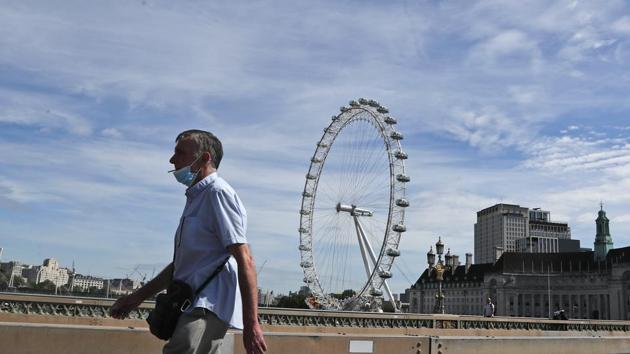Earlier this month, the government implemented a three-tiered system of restrictions in England to try to keep a second wave of the virus under control following a month-long lockdown. (AP file photo) Earlier this month, the government implemented a three-tiered system of restrictions in England to try to keep a second wave of the virus under control following a month-long lockdown. (AP file photo)