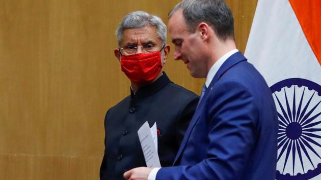 Britain's Foreign Secretary Dominic Raab and India's Foreign Minister Subrahmanyam Jaishankar leave after attending a joint news conference in New Delhi, India, December 15, 2020.(Reuters photo)