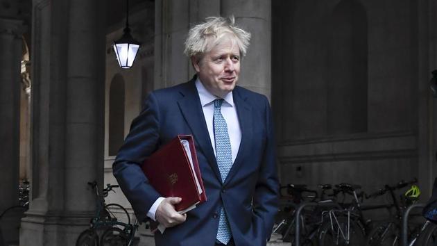 Britain's Prime Minister Boris Johnson returns to Downing Street after attending the government's weekly Cabinet meeting at the Foreign and Commonwealth Office, in London.(AP)