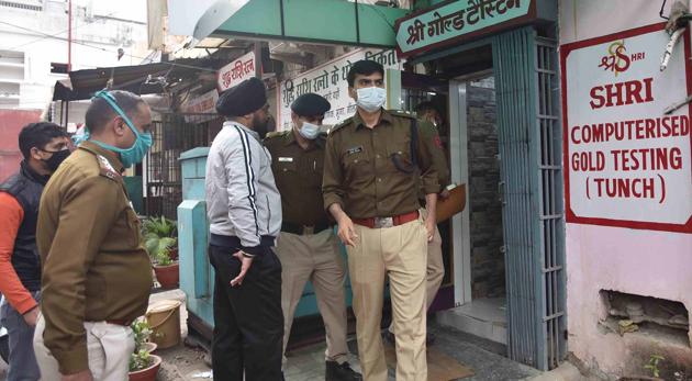 Chandigarh police investigate the shop in which the goldsmith was shot at in Chandigarh’s Sector 23 on December 9. (HT Photo) Chandigarh police investigate the shop in which the goldsmith was shot at in Chandigarh’s Sector 23 on December 9. (HT Photo)