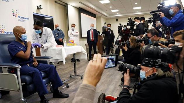 Members of the media are seen as Dr Yves Duroseau from Lennox Hill Hospital is inoculated with the Pfizer coronavirus disease (Covid-19) vaccine by Dr Michelle Chester from Northwell Health at Long Island Jewish Medical Center in New Hyde Park, New York, US on December 14, 2020. (Reuters File Photo) Members of the media are seen as Dr Yves Duroseau from Lennox Hill Hospital is inoculated with the Pfizer coronavirus disease (Covid-19) vaccine by Dr Michelle Chester from Northwell Health at Long Island Jewish Medical Center in New Hyde Park, New York, US on December 14, 2020. (Reuters File Photo)