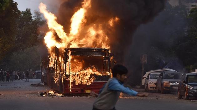 Violence over the amended citizenship act rocked the national capital on December 15, with public buses being set on fire in a busy south Delhi colony and police using tear gas on protesters gathered near Jamia Millia Islamia, a university that has remained tense following clashes on December 13 over the new law that had also roiled the North-east over the past week. (Sanjeev Verma / HT Photo)