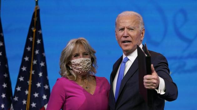 President-elect Joe Biden walks offstage with his wife Jill Biden after speaking after the Electoral College formally elected him as president, Monday, Dec. 14, 2020, at The Queen theater in Wilmington, Del. (AP Photo/Patrick Semansky) (AP) President-elect Joe Biden walks offstage with his wife Jill Biden after speaking after the Electoral College formally elected him as president, Monday, Dec. 14, 2020, at The Queen theater in Wilmington, Del. (AP Photo/Patrick Semansky) (AP)