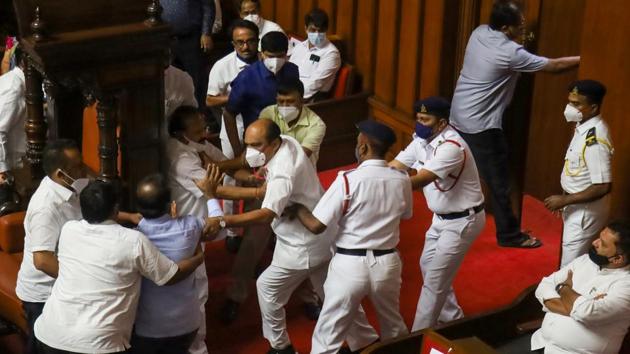 BJP and Congress leaders clash over the chairman post during the Karnataka Legislative Council session in Bengaluru. (PTI) BJP and Congress leaders clash over the chairman post during the Karnataka Legislative Council session in Bengaluru. (PTI)