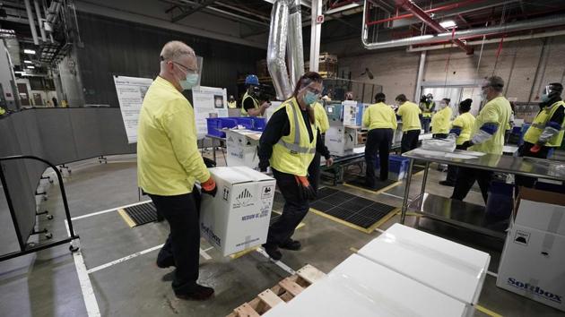 Boxes containing the Pfizer-BioNTech Covid-19 vaccine are prepared to be shipped at the Pfizer Global Supply Kalamazoo manufacturing plant on December 13.The vaccine began leaving the company's Michigan factory, ready to be injected into the arms of millions of the most vulnerable Americans as the global death toll topped 1.6 million. (Morry Gash / Pool / AFP) Boxes containing the Pfizer-BioNTech Covid-19 vaccine are prepared to be shipped at the Pfizer Global Supply Kalamazoo manufacturing plant on December 13.The vaccine began leaving the company's Michigan factory, ready to be injected into the arms of millions of the most vulnerable Americans as the global death toll topped 1.6 million. (Morry Gash / Pool / AFP)