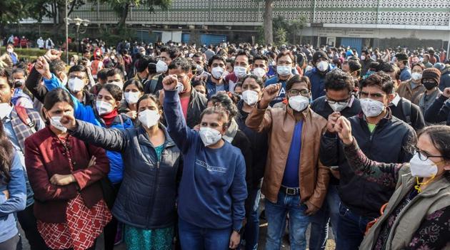 Members of AIIMS Nurses Union raise slogans during their indefinite strike over their long-pending demands, including those concerning the Sixth Central Pay Commission and against contractual appointments in New Delhi on Tuesday. (PTI Photo) Members of AIIMS Nurses Union raise slogans during their indefinite strike over their long-pending demands, including those concerning the Sixth Central Pay Commission and against contractual appointments in New Delhi on Tuesday. (PTI Photo)