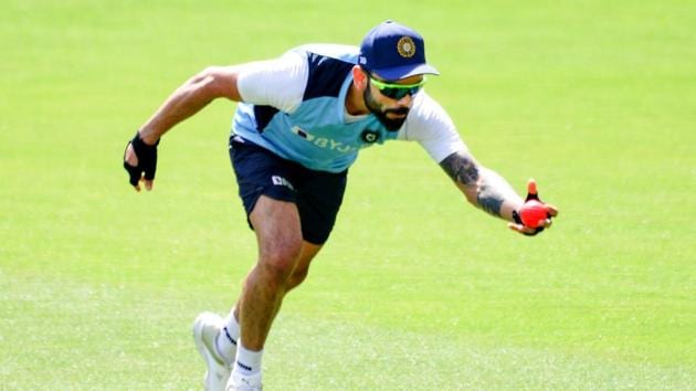 India's captain Virat Kohli catches the ball during a training session in Adelaide on December 15, 2020, ahead of the first Test cricket match between Australia and India.(AFP)