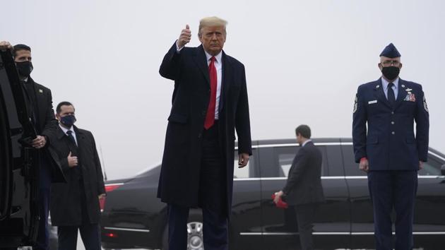 President Donald Trump gives a thumbs up as h arrives at New York Stewart International Airport in New Windsor, N.Y., Saturday, Dec. 12, 2020, before traveling on to the United States Military Academy in West Point, N.Y. to attend the 121st Army-Navy Football Game at Michie Stadium. (AP Photo/Andrew Harnik) (AP) President Donald Trump gives a thumbs up as h arrives at New York Stewart International Airport in New Windsor, N.Y., Saturday, Dec. 12, 2020, before traveling on to the United States Military Academy in West Point, N.Y. to attend the 121st Army-Navy Football Game at Michie Stadium. (AP Photo/Andrew Harnik) (AP)