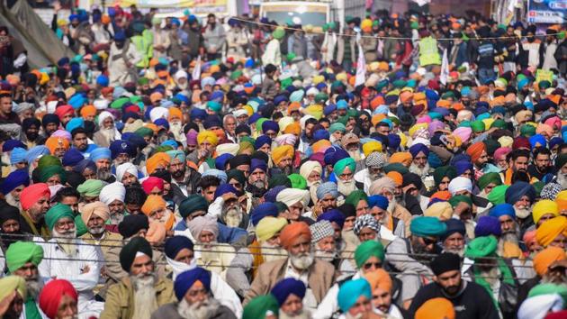 Farmers stage a protest against the Centre's new farm laws, at Singhu border near Delhi on Tuesday.(PTI Photo)