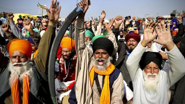 Protesting farmer leaders shout slogans as they sit on a day long hunger strike at the Delhi- Haryana border, outskirts of New Delhi.(AP)