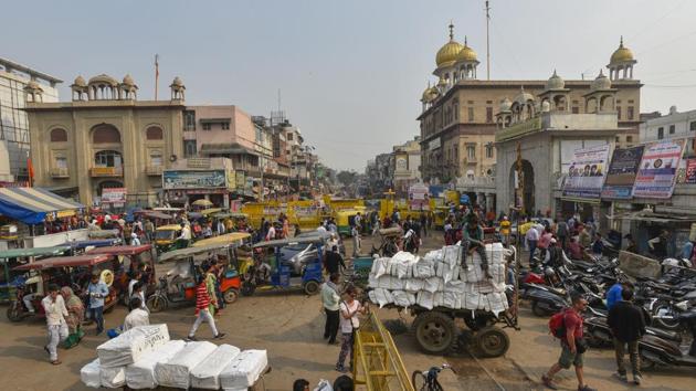 People and police barricades are seen at Chandni Chowk where construction is ongoing as part of its redevelopment plan, in New Delhi on November 21, 2019.(Burhaan Kinu/HT PHOTO) People and police barricades are seen at Chandni Chowk where construction is ongoing as part of its redevelopment plan, in New Delhi on November 21, 2019.(Burhaan Kinu/HT PHOTO)