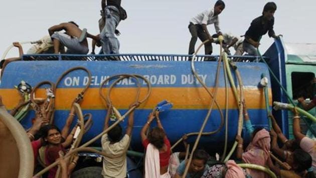 Residents of Tughlakabad fill their containers with drinking water from a water tanker provided by the state-run Delhi Jal Board in New Delhi near Tughlakabad in New Delhi. (Raj K Raj /HT File Photo) Residents of Tughlakabad fill their containers with drinking water from a water tanker provided by the state-run Delhi Jal Board in New Delhi near Tughlakabad in New Delhi. (Raj K Raj /HT File Photo)