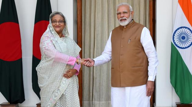 Prime Minister Narendra Modi greets Bangladesh Prime Minister Sheikh Hasina before their bilateral talk, at Hyderabad House.(Mohd Zakir/HT PHOTO)