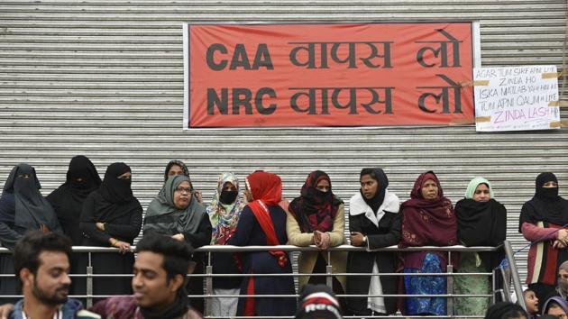 Women gathered under a banner at Shaheen Bagh, on January 6. The 101-day long protest had its share of critics, including thousands of commuters who used road 13A to commute between Delhi and Noida daily. There were massive traffic jams across the city. Police diversions led to serpentine traffic jams during peak hours. Multiple petitions were filed in courts urging police to intervene and ask protesters to vacate the road. (Burhaan Kinu / HT Archive)