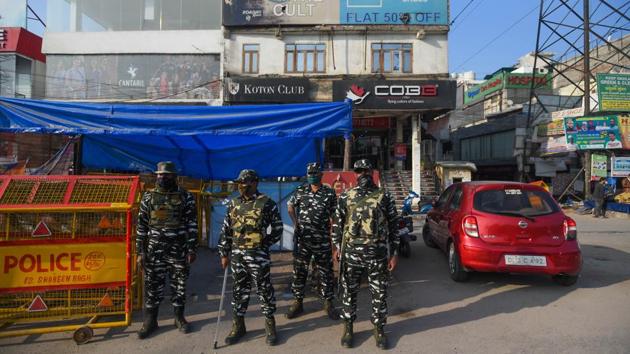 Security personnel at Shaheen Bagh on December 14. At least 15 shops in the roughly 200-shop market have shut permanently in one year -- not just because of Covid-19, but also due to concerns of increased surveillance and police scrutiny, according to locals. When lockdown norms were relaxed in May, one shopkeeper said the fear of the virus had kept the shoppers away. About 60 other shops have not reopened yet. (Amal KS / HT Archive)