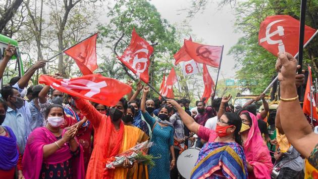 Left Democratic Front (LDF) supporters celebrate their party's lead in the Kerala local body elections in Kochi, Wednesday.(PTI Photo)