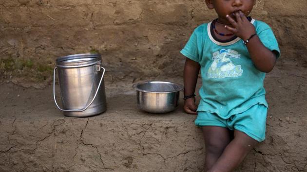 A child has lentil and rice for lunch at a village in Banda District, Uttar Pradesh. (Bloomberg) A child has lentil and rice for lunch at a village in Banda District, Uttar Pradesh. (Bloomberg)