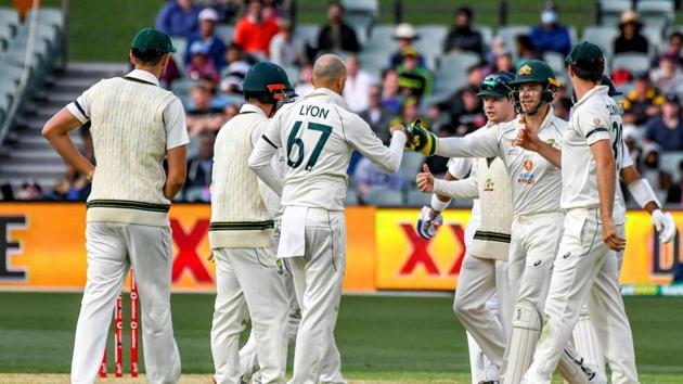 Australia's Nathan Lyon (C) celebrates his wicket of Indian batsman Cheteshwar Pujara with teammates during the day one of the first cricket Test match between Australia and India in Adelaide on December 17, 2020. (AFP) Australia's Nathan Lyon (C) celebrates his wicket of Indian batsman Cheteshwar Pujara with teammates during the day one of the first cricket Test match between Australia and India in Adelaide on December 17, 2020. (AFP)