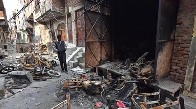 A man stands near burnt motorcycles in a riot-affected area at Shiv Vihar, in New Delhi on March 2, 2020.(Sanchit Khanna/HT Photo) A man stands near burnt motorcycles in a riot-affected area at Shiv Vihar, in New Delhi on March 2, 2020.(Sanchit Khanna/HT Photo)