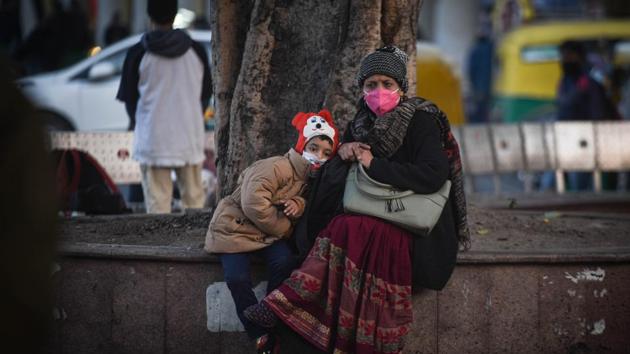 A woman and child wearing face masks while out on a winter day at Connaught Place in New Delhi on December 17. The ministry also said that India’s recovery rate is among the highest in the world. “While the global figure for Recovery Rate is 70.27%, India is recording 95.31%. USA, Brazil, Russia, and Italy are reporting lesser recovery rates,” it said. (Sanchit Khanna / HT Photo)