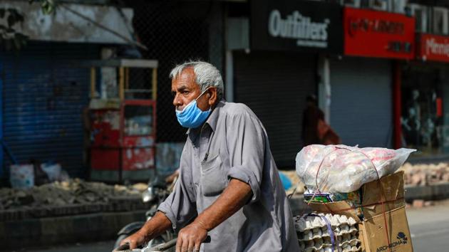 A man wears protective mask as he rides a bicycle loaded with supplies amid the outbreak of the coronavirus disease (Covid-19) in Karachi, Pakistan. (Reuters) A man wears protective mask as he rides a bicycle loaded with supplies amid the outbreak of the coronavirus disease (Covid-19) in Karachi, Pakistan. (Reuters)