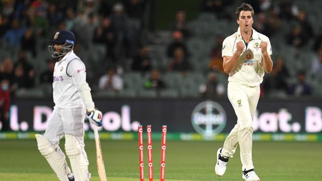 Australian bowler Pat Cummins reacts after dismissing Indian batsman Prithvi Shaw (L) for 4 runs on day 2 of the first test match between Australia and India at Adelaide Oval, Adelaide, Australia, December 18, 2020.(REUTERS)