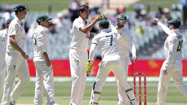 Australia's Mitchell Starc, center, is congratulated by teammates after taking the wicket of India's Wriddhiman Saha on the second day of their cricket test match at the Adelaide Oval in Adelaide, Australia, Friday, Dec. 18, 2020.(AP) Australia's Mitchell Starc, center, is congratulated by teammates after taking the wicket of India's Wriddhiman Saha on the second day of their cricket test match at the Adelaide Oval in Adelaide, Australia, Friday, Dec. 18, 2020.(AP)