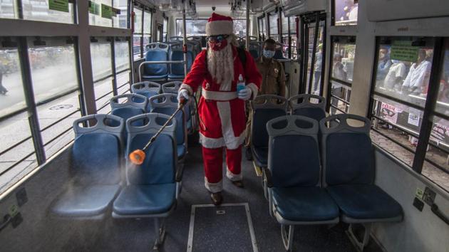 A man dressed as Santa Claus sanitizes a bus during a Covid-19 awareness drive at Sion in Mumbai on December 17. The country added 338 case fatalities from Covid-19 in the past 24 hours. Ten States and union territories account for 75.15% of new deaths, of which Maharashtra added the most with 65. India has kept daily deaths below 500 for almost a fortnight now. (Pratik Chorge / HT Photo)