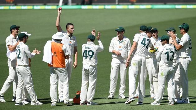 Australian bowler Josh Hazlewood shows the ball after taking his 5th wicket on day 3 of the first test match between Australia and India at Adelaide Oval, Adelaide, Australia, December 19, 2020.(Reuters)