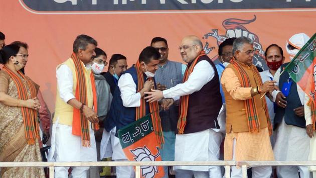 Former TMC leader Suvendu Adhikari joins BJP in presence of Union Home Minister Amit Shah during a public rally, in Midnapore. (ANI) Former TMC leader Suvendu Adhikari joins BJP in presence of Union Home Minister Amit Shah during a public rally, in Midnapore. (ANI)