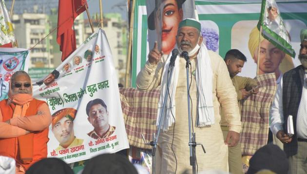 Bharatiya Kisan Union (BKU) leader Rakesh Tikait addressing the gathering during the ongoing protest against the new farm laws at Ghazipur (Delhi-UP border) near Ghaziabad on Wednesday. (Sakib Ali/HT Photo) Bharatiya Kisan Union (BKU) leader Rakesh Tikait addressing the gathering during the ongoing protest against the new farm laws at Ghazipur (Delhi-UP border) near Ghaziabad on Wednesday. (Sakib Ali/HT Photo)